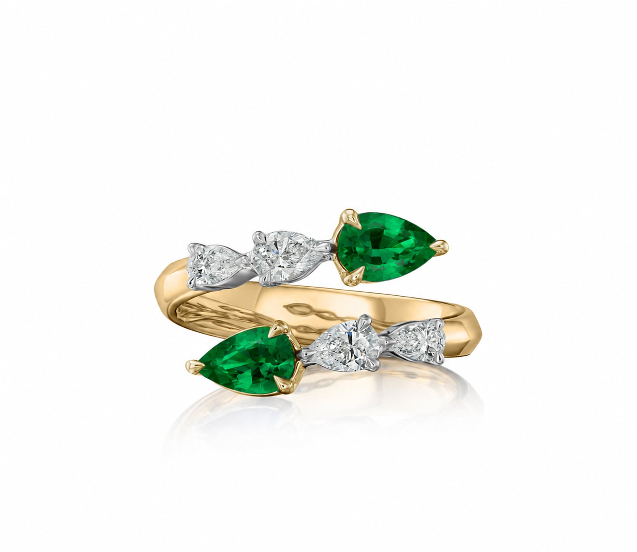18k yellow gold and platinum open crossover ring with pear-shaped Colombian emeralds and graduated pear-shaped natural diamonds.