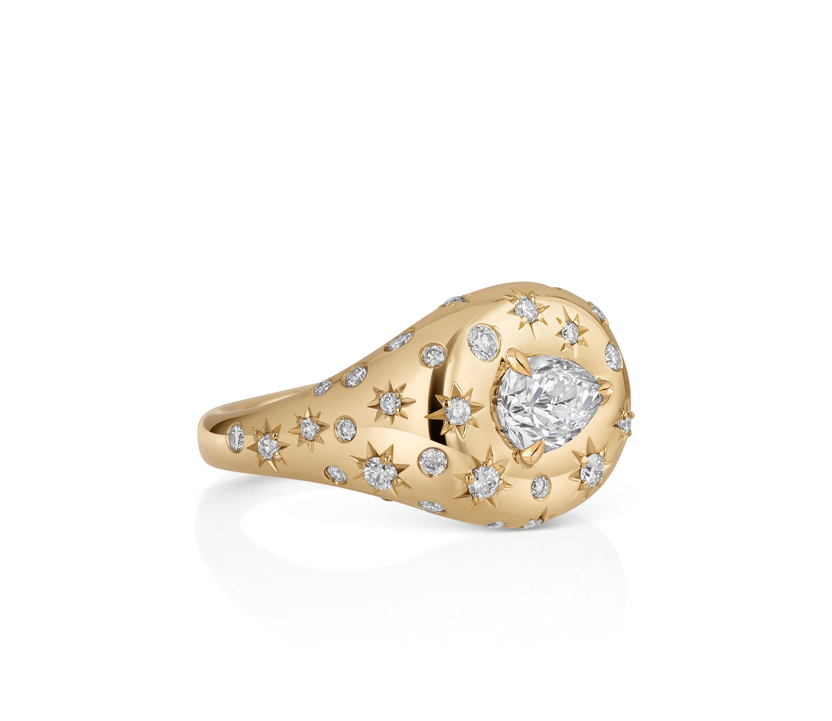side view of an 18k yellow gold domed signet ring with a central east-west pear-shaped natural diamond and scattered star-set and burnished diamond accents.