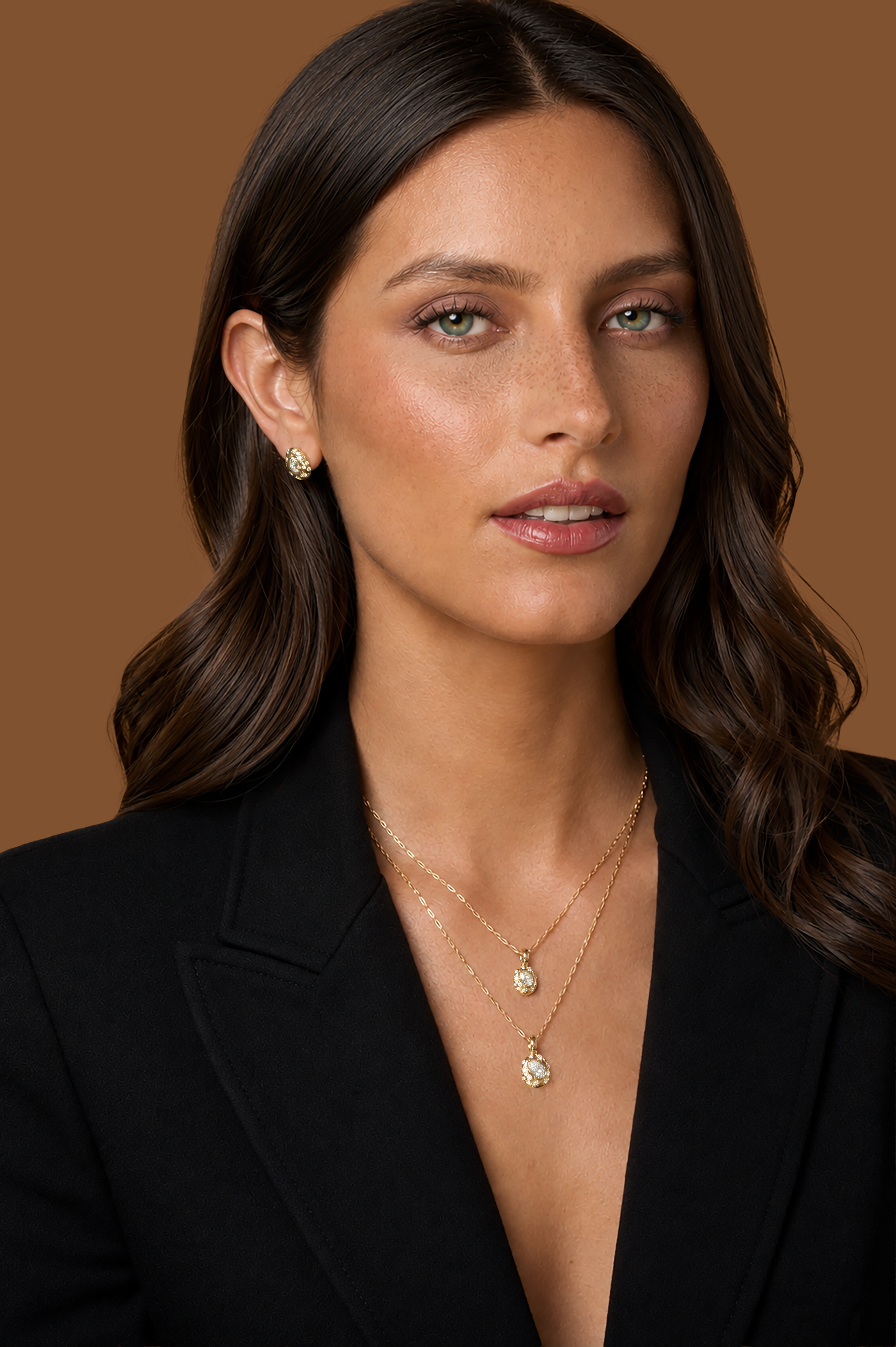 A woman westomh 18k yellow gold connector necklace with a diamond-accented clasp designed to hold pendants, featuring burnished and star-set natural diamonds.