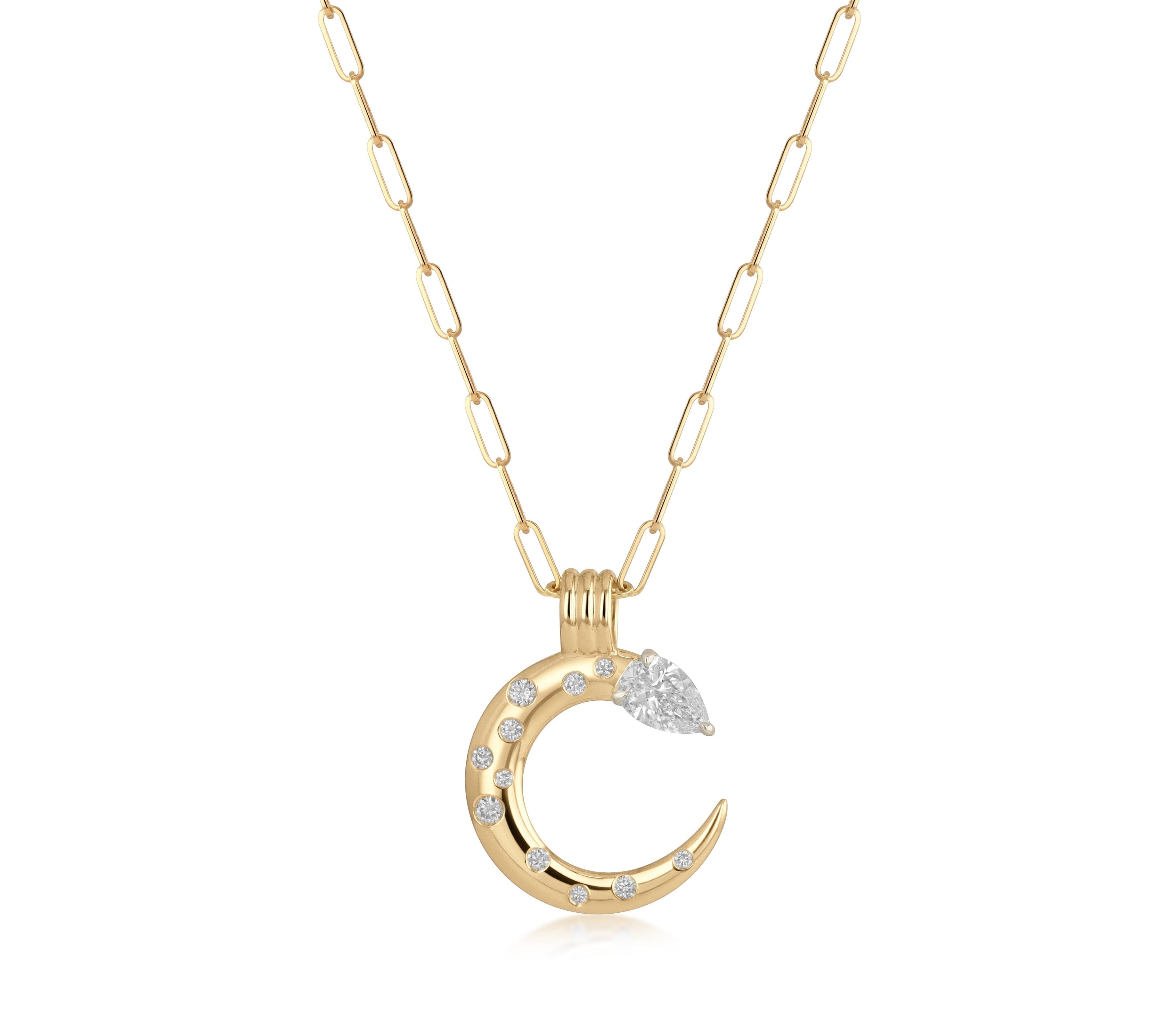 A 18k yellow gold pendant featuring a pear-shaped natural diamond and a crescent of burnished round natural diamond accents in a paperclip chain
