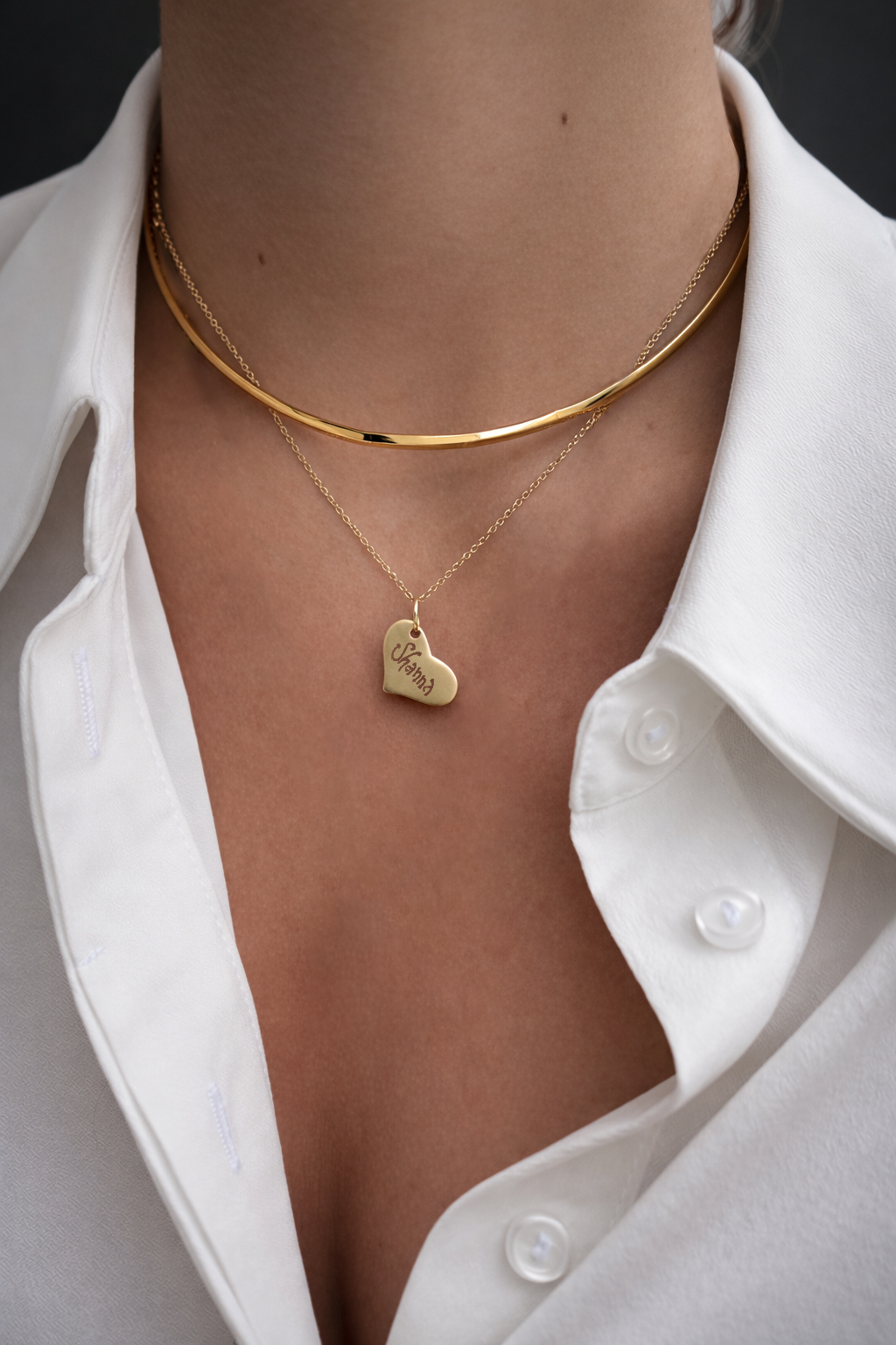14k yellow gold heart name tag necklace personalized with engraved name worn layered with gold choker