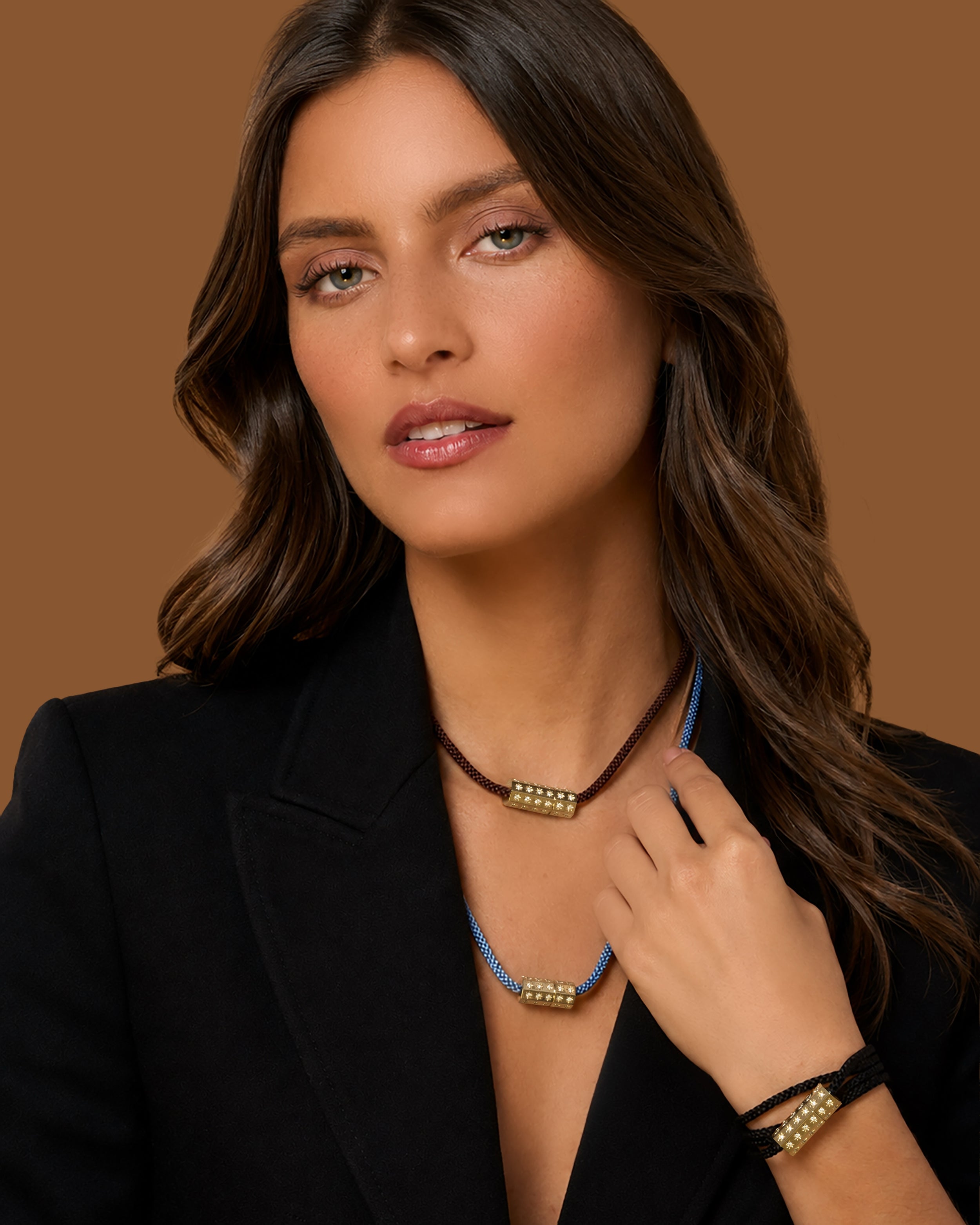Model wearing layered Octagon Medium Connection Clasp Kumihimo necklaces in brown and blue woven silk with a matching black silk bracelet, accented with burnished and star-set natural diamonds.