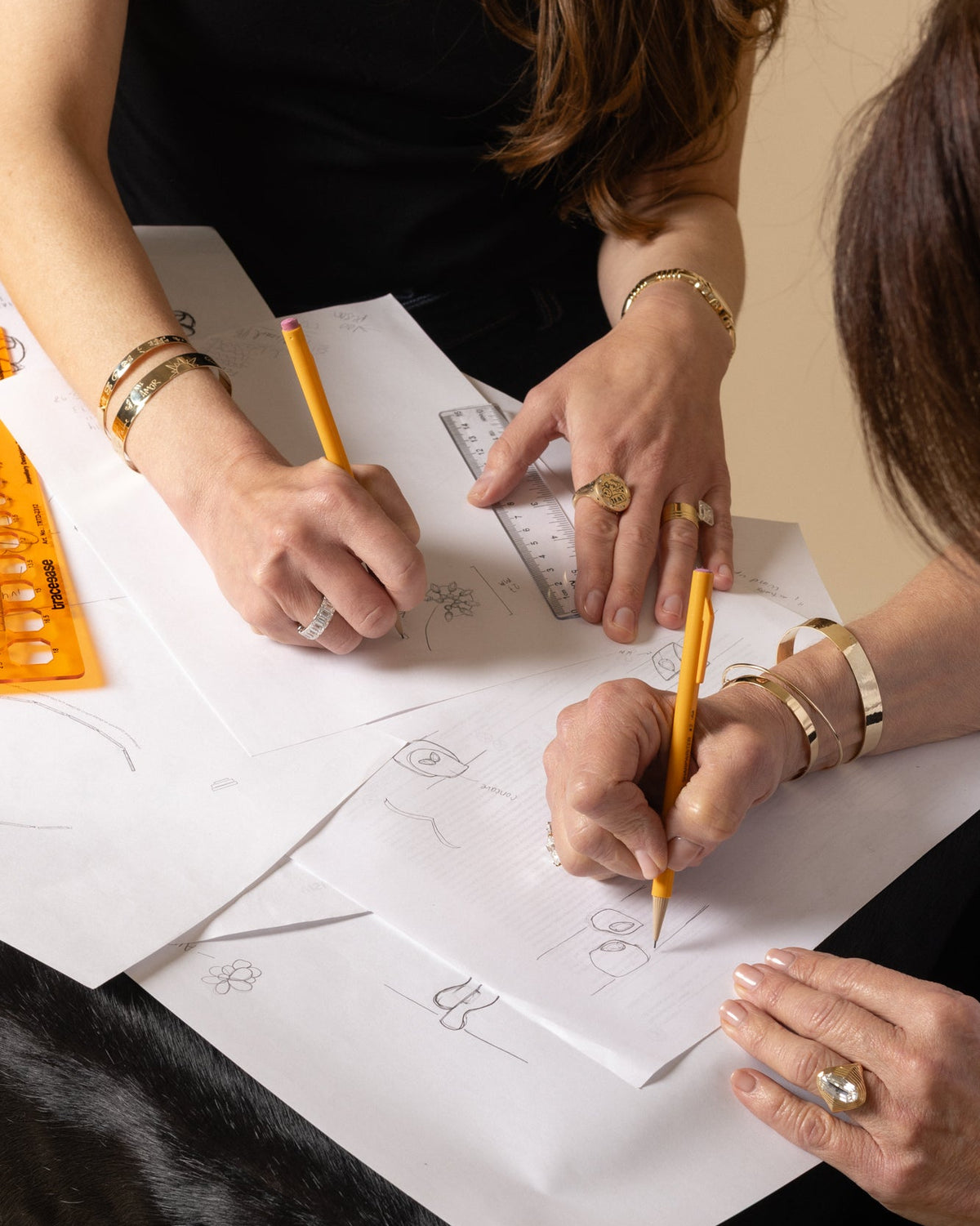 Designers sketching jewelry by hand in the Miami Beach atelier